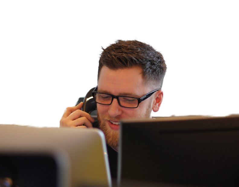An XL Marketing team member qualifying a lead by phone